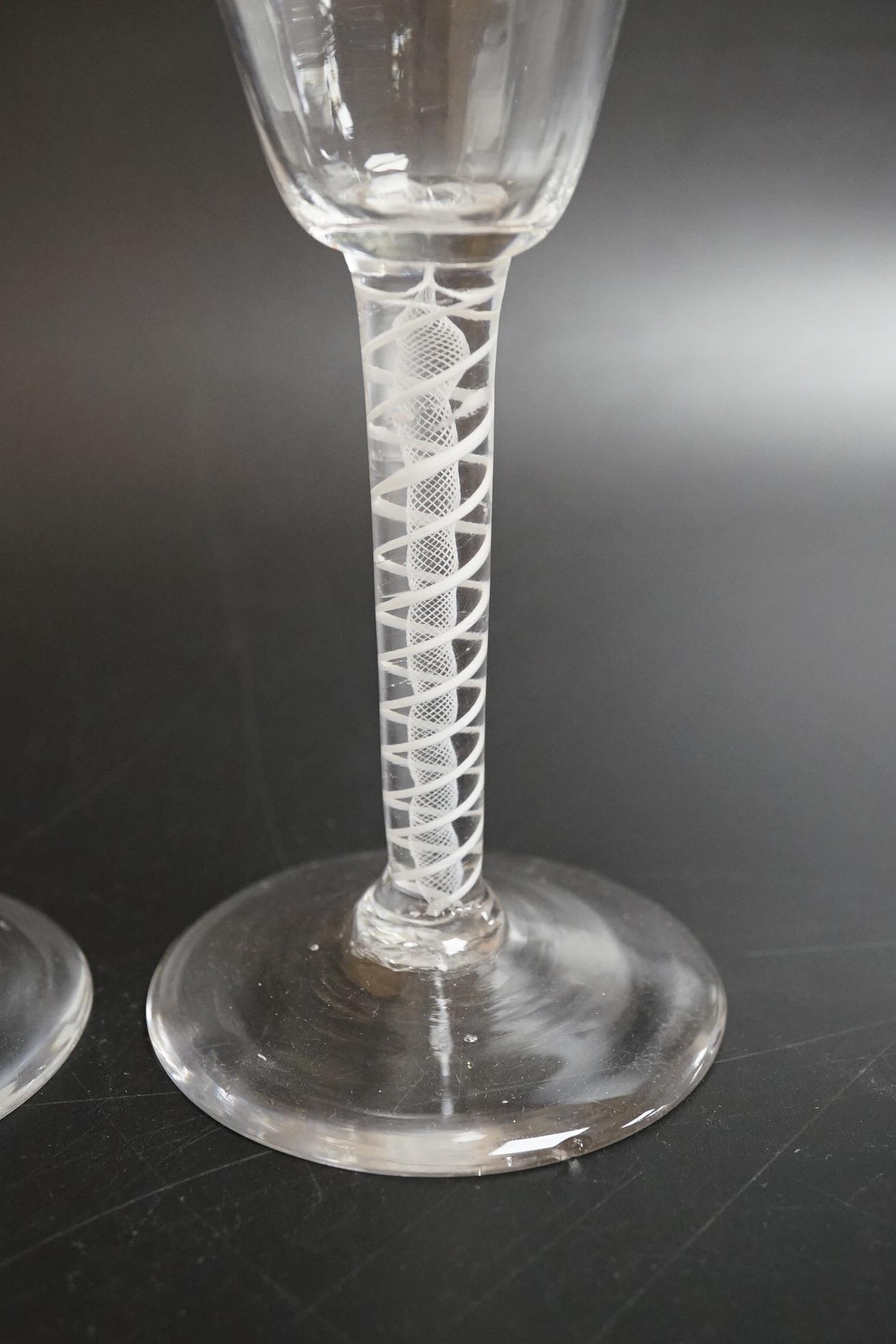 A near pair of opaque twist wine glasses, c.1760, 17.3cm high